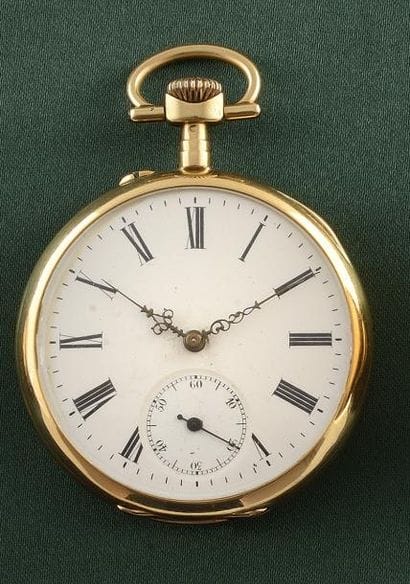 MONTRE DE POCHE

Boîtier rond en or jaune...
