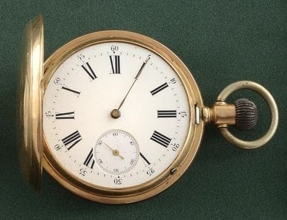 MONTRE DE POCHE

Boîtier rond en or jaune...