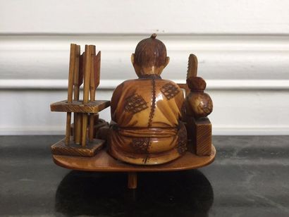 JAPON Netsuke en ivoire représentant un artisan...