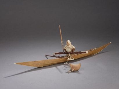 Eskimo hunting seals in his kayak.
Wood,...