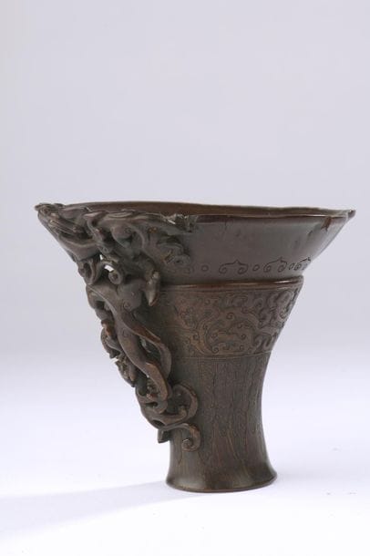 Rhinoceros horn libation cup carved on the...