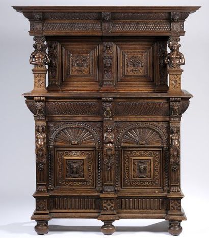 Carved oak dressoir opening with four doors...