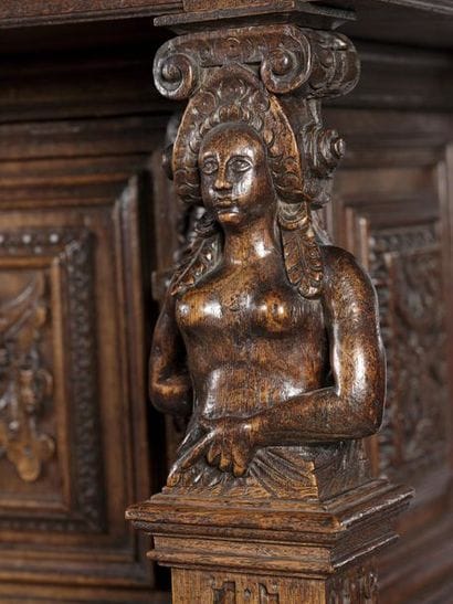 Carved oak dressoir opening with four doors...