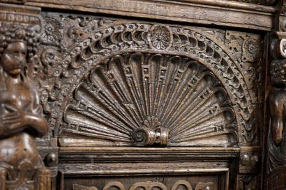Carved oak dressoir opening with four doors...