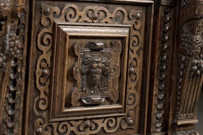 Carved oak dressoir opening with four doors...