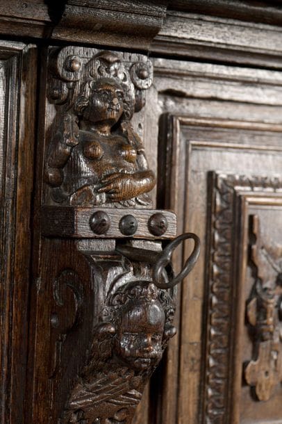 Carved oak dressoir opening with four doors...