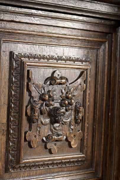 Carved oak dressoir opening with four doors...