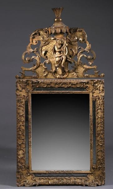 Important mirror with beads in carved, stuccoed...