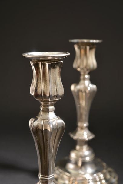 Pair of silver plated bronze torches, the...