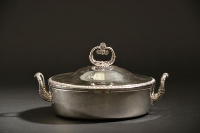 Silver covered vegetable dish edged with...