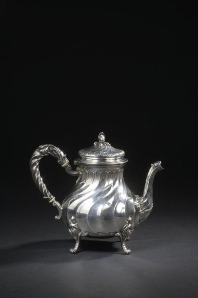 Silver paneled jug with torso ribs and rocailles...