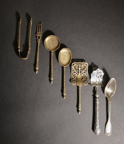 Part of a silver candy set, the twisted handles...