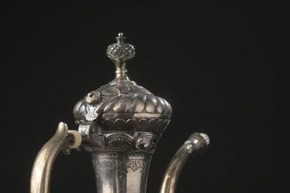 Silver ewer with long neck and slightly flattened...
