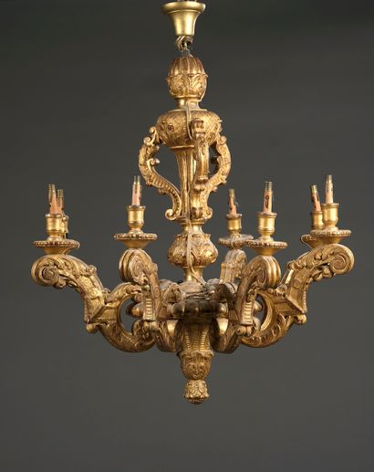 Carved wood chandelier and gilded composition...