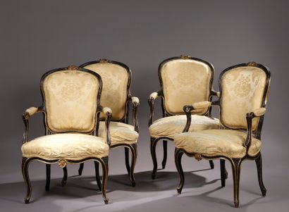 A suite of four high-backed, violin-sculpted...