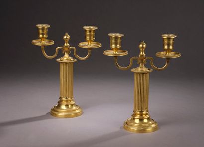 Pair of chased and gilded bronze torches...