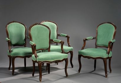 Suite of four armchairs in moulded and carved...