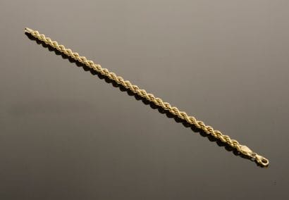 Bracelet in 18k yellow gold with twisted...