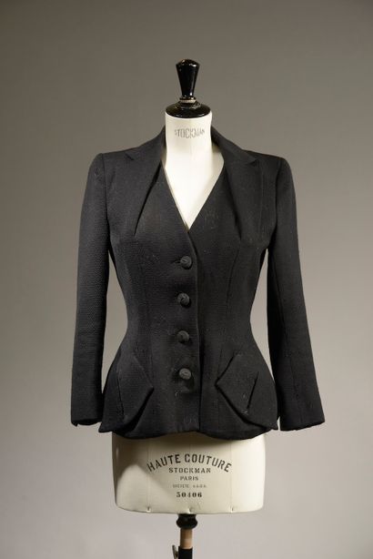 JOHN GALLIANO.

Belted black wool jacket,...