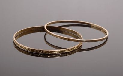 Set of two 18k yellow gold bracelets, one...