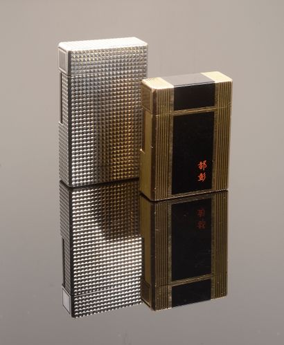 ST. DUPONT. 

 Set of two lighters including:...