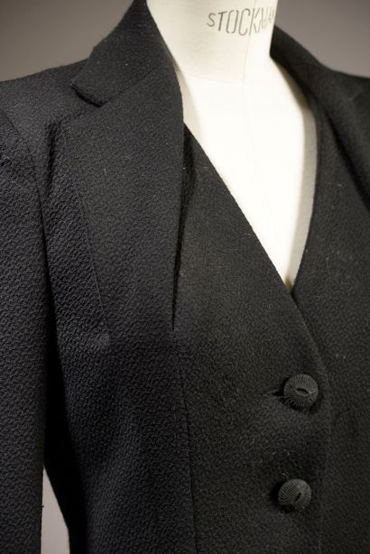 JOHN GALLIANO.

Belted black wool jacket,...