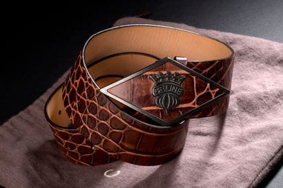 CELINE.

Brown leather belt, reptile style,...