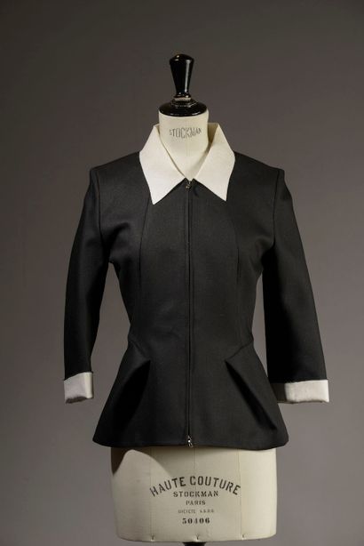 RM.

Belted black wool jacket, small collar,...