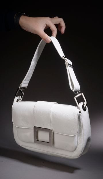 ROGER VIVIER.

Glazed white leather handbag,...