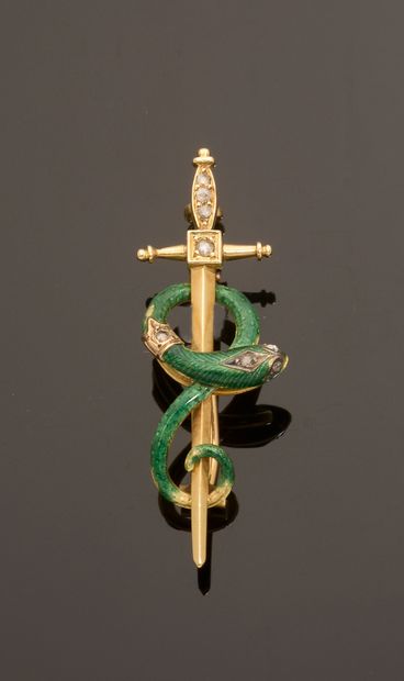 18k yellow gold brooch featuring a sword...