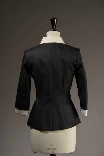 RM.

Belted black wool jacket, small collar,...