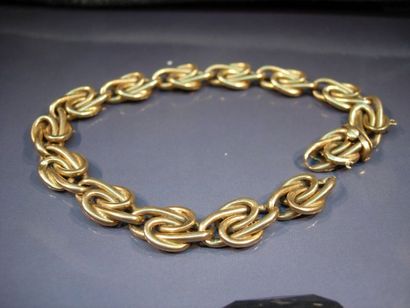 Bracelet en or jaune à maillons noués. Vers...