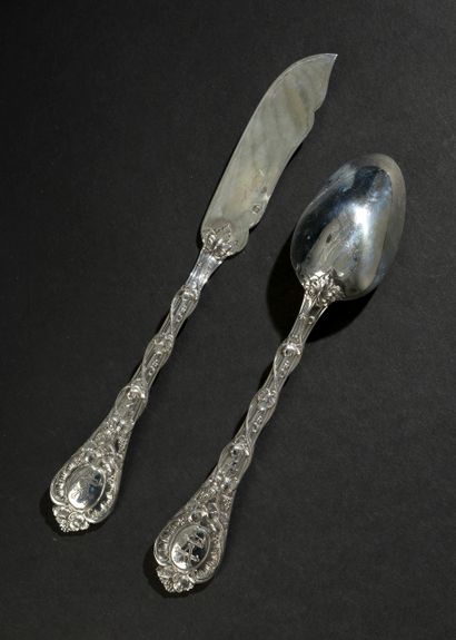 Twelve large spoons and twelve knives with...