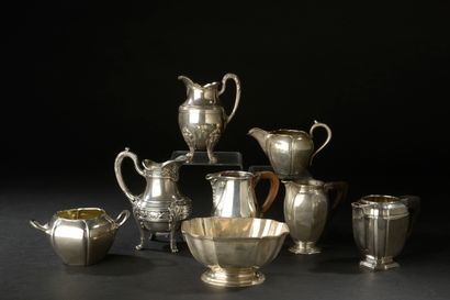 Six milk jugs, three of them with rosewood...