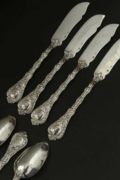 Twelve large spoons and twelve knives with...