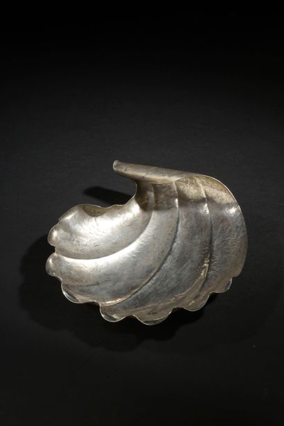 Cup shell rolled up at one end in hammered...