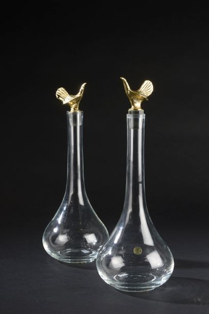 Pair of crystal decanters, the stoppers surmounted...