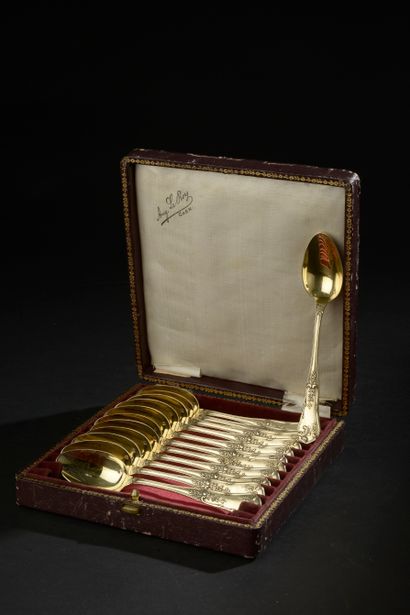Twelve small spoons out of silver gilded...