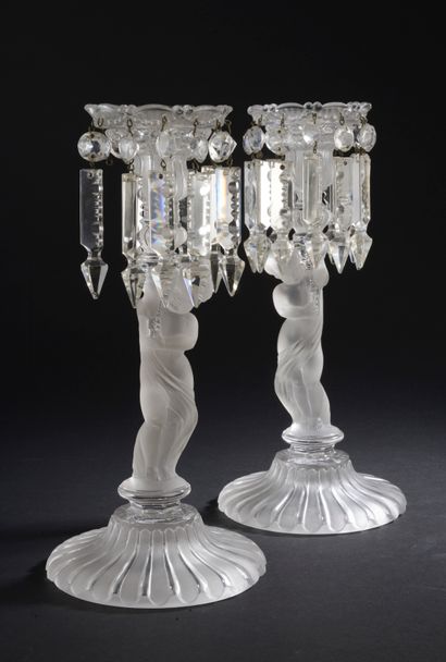 Pair of girandoles or torches in clear molded...