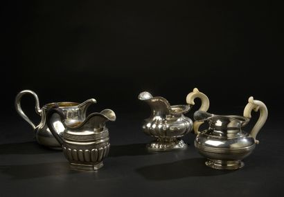 Four small silver milk jugs 875 thousandths,...