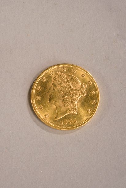 Pièce de 20 dollars 
en or jaune 900 millièmes,...