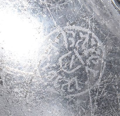 Cup out of pressed moulded crystal of moved...