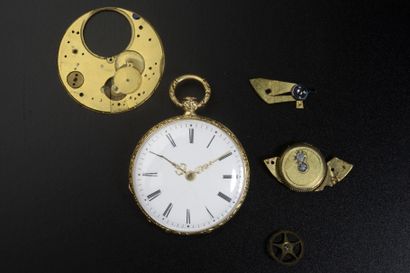Montre de poche en or jaune 18K (démontée).
Poids...