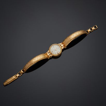 REGIS.
Montre bracelet, boîtier rond en or...