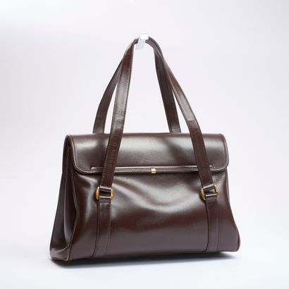 GUCCI.
Sac à main en veau box marron à deux...