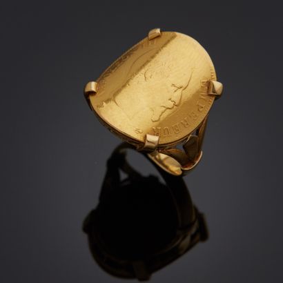 Bague en or jaune 18k sertie d'une pièce...