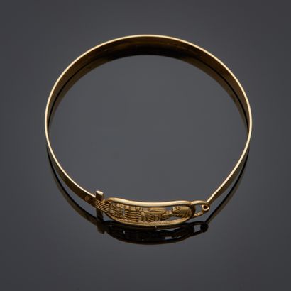 Bracelet en or jaune 18k figurant un cartouche...