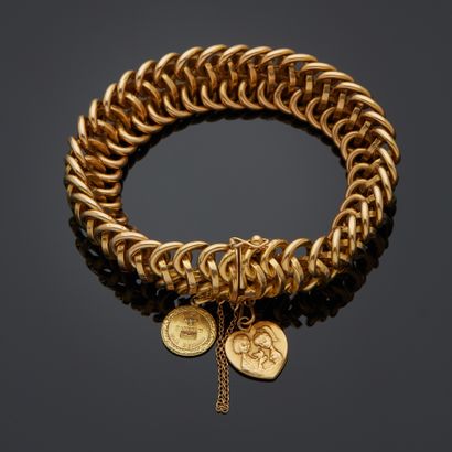 Bracelet en or jaune 18k à maille américaine...