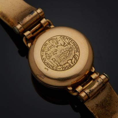 REGIS.
Montre bracelet, boîtier rond en or...