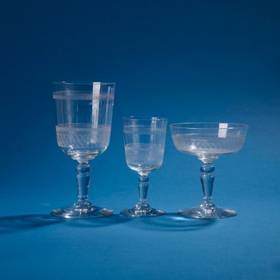 Part of an engraved glass service.
Includes:...